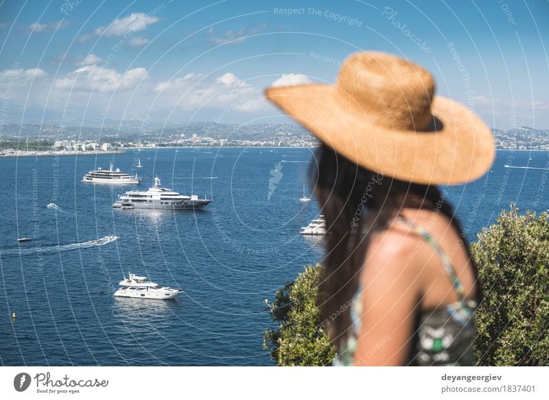 Woman with summer hat watching yachts Lifestyle Luxury Happy Beautiful Relaxation Vacation & Travel Tourism Cruise Summer Beach Ocean Human being Girl Adults