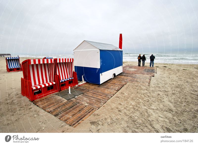 off-season Rügen Baltic Sea Prora Beach Ocean Waves Wind Clouds Beach chair Red Blue White ice car Kiosk french fries red white end of season Winter break