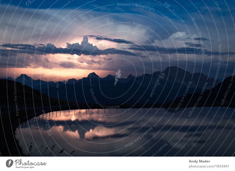 Thunderstorms in the mountains Nature Landscape Water Storm clouds Night sky Alps Lakeside Adventure Thunder and lightning Reflection Mountain lake flash Clouds