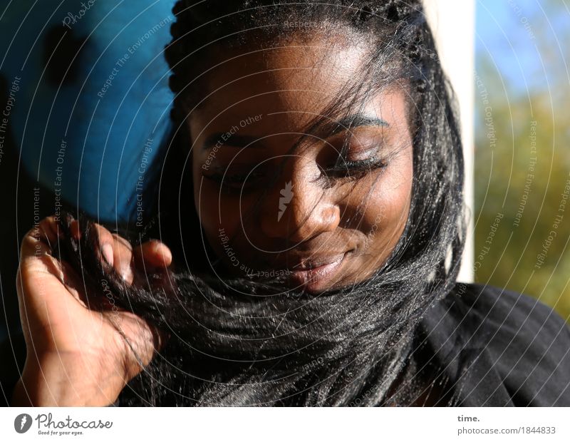 . Feminine 1 Human being Beautiful weather Wall (barrier) Wall (building) Jacket Black-haired Long-haired Afro Touch Relaxation To hold on Smiling Dream