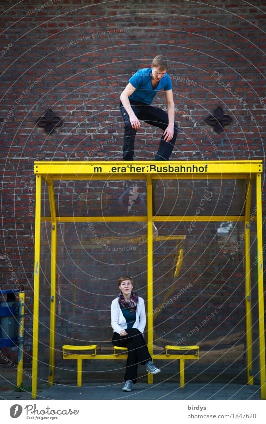 surprising encounter Masculine Feminine Young woman Youth (Young adults) Young man 2 Human being 18 - 30 years Adults Bus stop Shelter Wall (barrier)