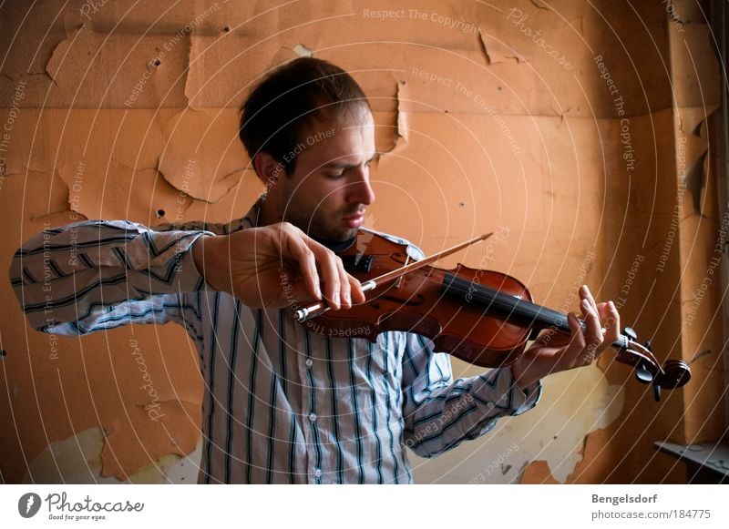 hangover Colour photo Interior shot Central perspective Upper body Front view Downward Closed eyes Harmonious Senses Calm Leisure and hobbies Playing