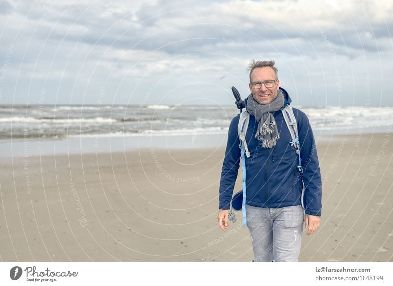 Middle-aged man with glasses walking on the beach Face Vacation & Travel Beach Ocean Waves Winter Hiking Man Adults 1 Human being 30 - 45 years Sand Clouds