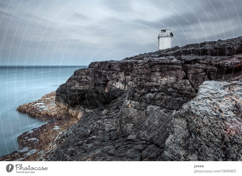 Pan-pan Landscape Sky Clouds Horizon Rock Coast Ireland Tower Lighthouse Gloomy Blue Brown Gray White Calm Safety Colour photo Subdued colour Exterior shot