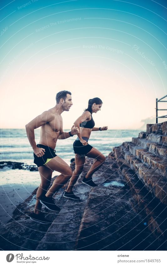 Two young adult athletes doing running exercise Lifestyle Body Health care Athletic Fitness Wellness Summer Beach Sports Jogging Couple Youth (Young adults)