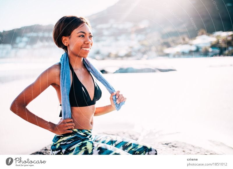 African young women sitting on beach after fitness workout Lifestyle Joy Body Wellness Harmonious Relaxation Summer Beach Ocean Sports Fitness Sports Training