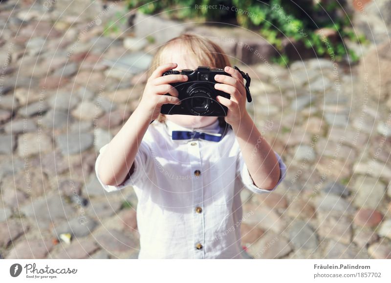 Photographer. Masculine Child Boy (child) Infancy 3 - 8 years Art Artist Event Media Print media Film industry Video Shirt Bow tie Small Cool (slang) Eternity