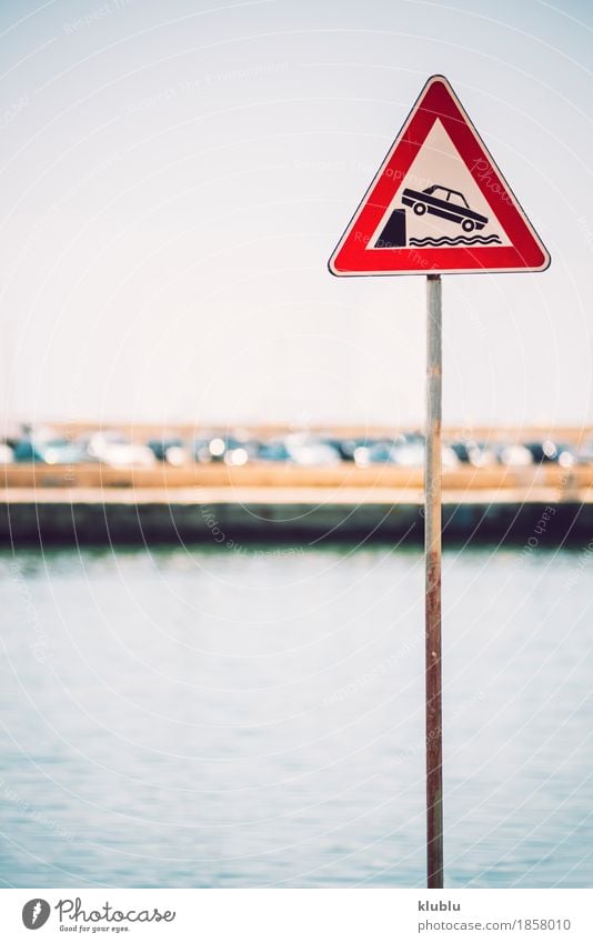 Danger Traffic siign. Risk of falling into water in a harbor Pot Ocean House (Residential Structure) Decoration Flower Coast Town Harbour Building Facade