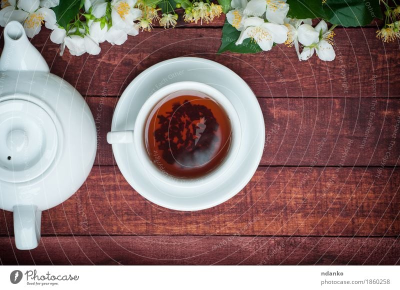 cup of black tea with a teapot and jasmine branches Breakfast Beverage Hot drink Coffee Tea Mug Table Plant Flower Leaf Blossom Wood Blossoming Fresh Brown