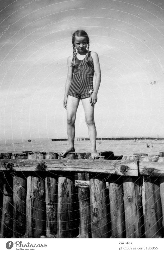 Badenixe 1937 Girl Exterior shot Looking into the camera bathe Vacation & Travel Summer vacation Beach Ocean Waves bunnies wooden posts Child Water