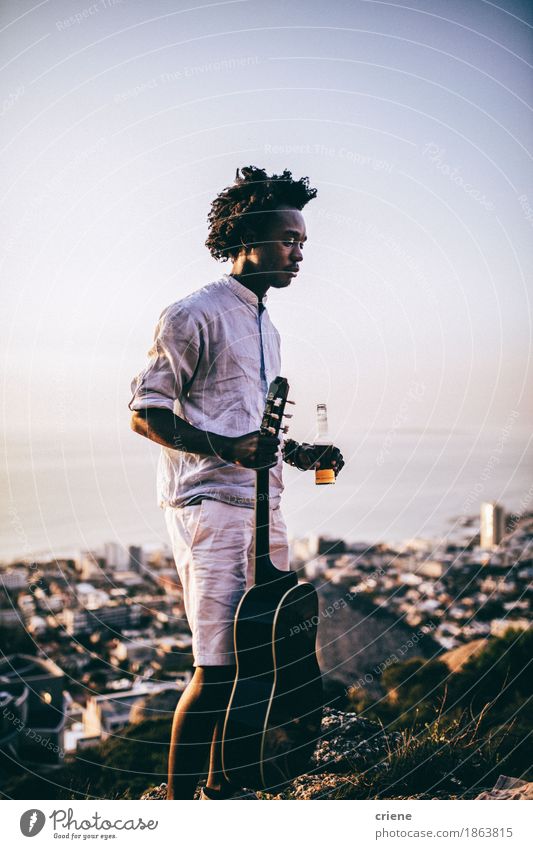 African young men with guitar and beer at outdoor party Drinking Beer Bottle Lifestyle Joy Relaxation Leisure and hobbies Vacation & Travel Camping Summer Party