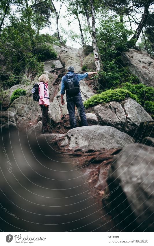 Senior Couple hiking trough mountains on cloudy summer day Lifestyle Joy Relaxation Leisure and hobbies Vacation & Travel Tourism Trip Adventure Camping Summer