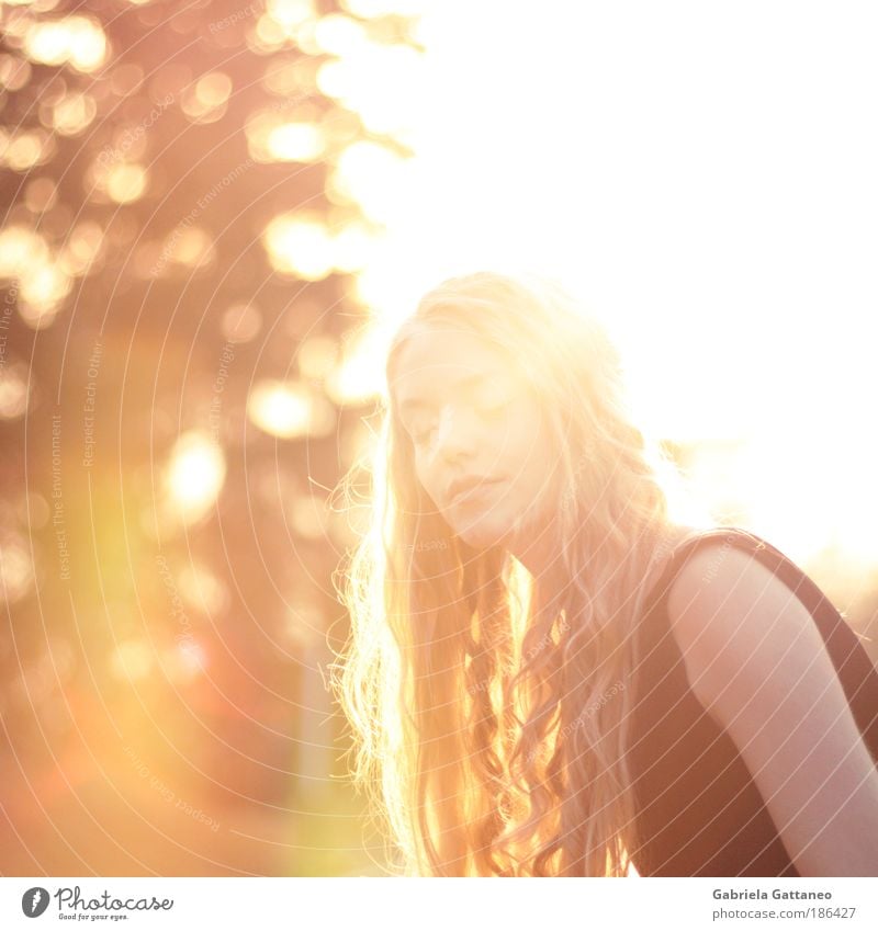 high tide Feminine Hair and hairstyles Face Breathe To enjoy Illuminate Bright Beautiful Yellow Gold Colour photo Exterior shot Copy Space left Copy Space top