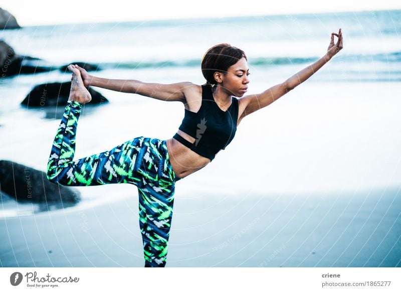 African women doing yoga pose on beach in early morning Lifestyle Beautiful Body Athletic Fitness Wellness Harmonious Relaxation Calm Meditation