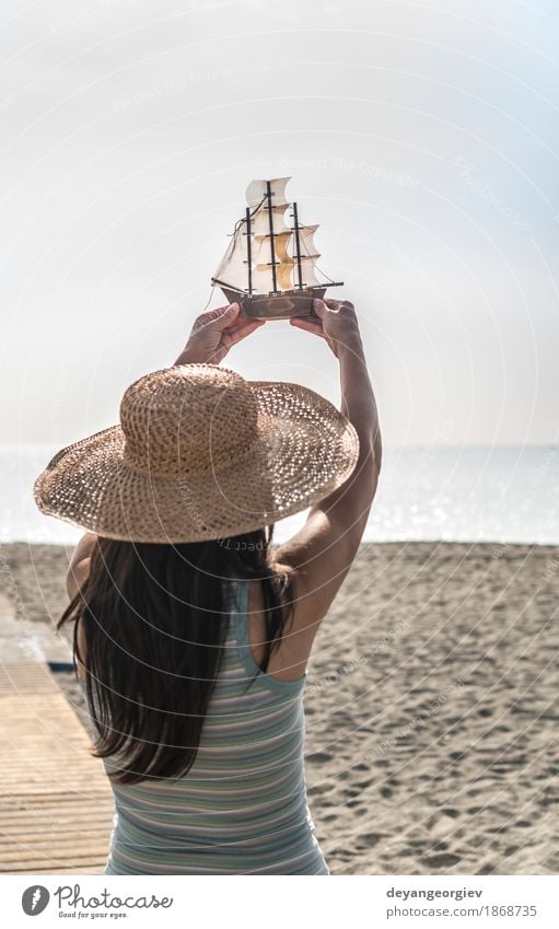 Woman with hat hold boat model Joy Happy Beautiful Vacation & Travel Tourism Summer Beach Ocean Decoration Girl Adults Hand Nature Yacht Sailboat Watercraft Hat