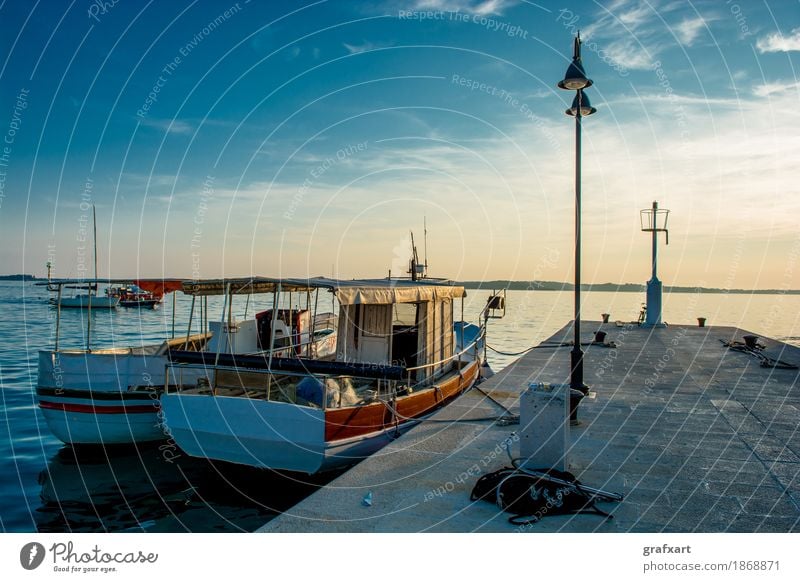 Boats anchoring at jetty in Croatia at sunset Harbour Coast Watercraft Peaceful Sunset Jetty Evening Old Anchor Drop anchor Twilight Second-hand Sky