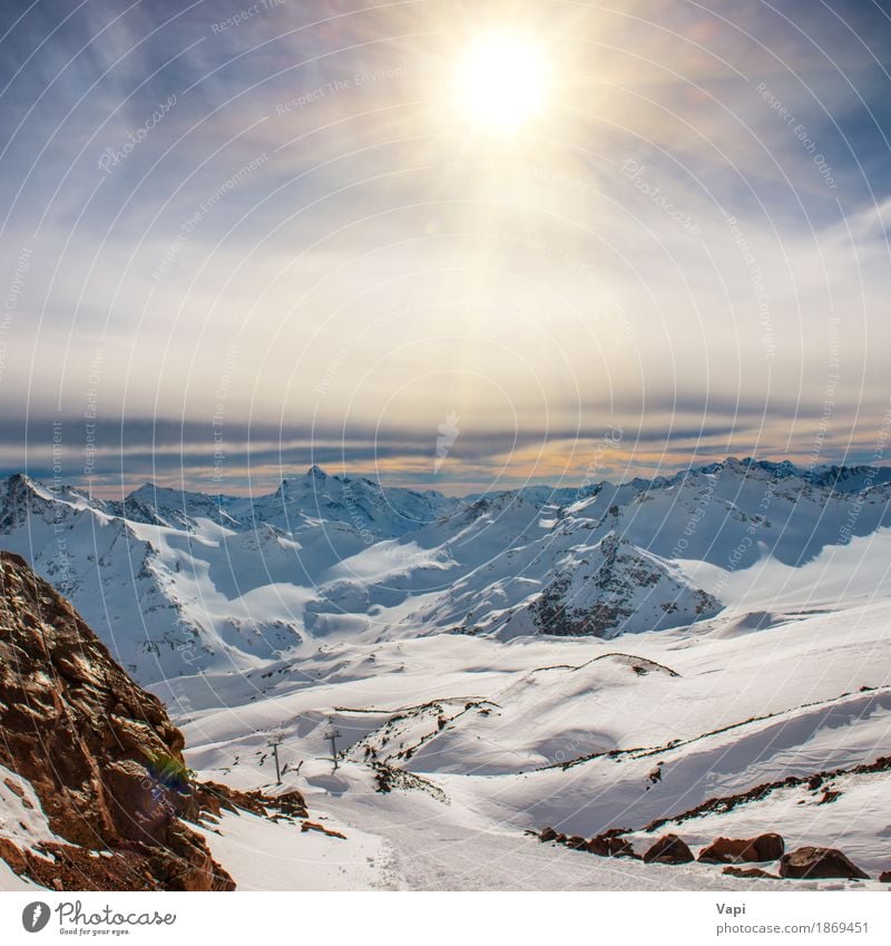 Snowy blue mountains in clouds at sunset Vacation & Travel Tourism Adventure Sun Winter Winter vacation Mountain Climbing Mountaineering Nature Landscape Sky