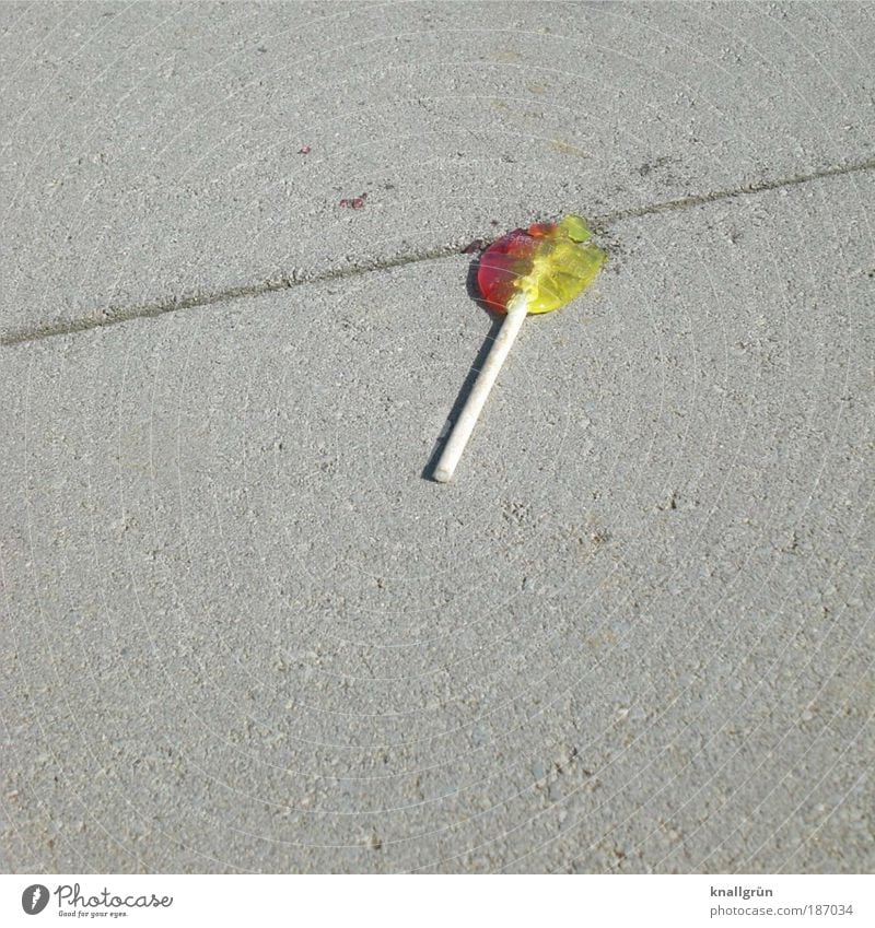 lollipop Food Candy Lie Broken Delicious Round Sweet Yellow Gray Red White Squander Loneliness Infancy Decline Luxury Ground Sidewalk sucked away jettisoned