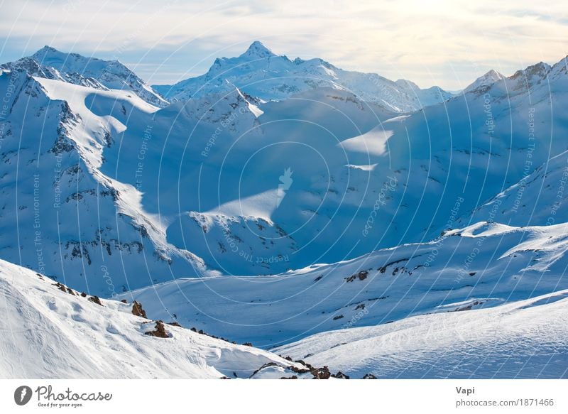 Snowy blue mountains in clouds Vacation & Travel Tourism Adventure Winter Winter vacation Mountain Climbing Mountaineering Skis Nature Landscape Sky Clouds