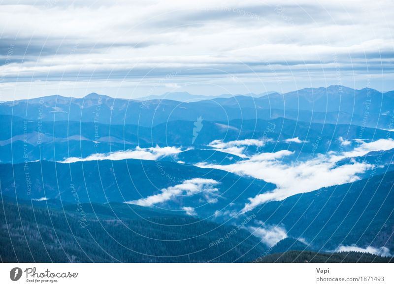 Blue mountains covered with white clouds Vacation & Travel Tourism Adventure Mountain Environment Nature Landscape Sky Clouds Horizon Fog Forest Hill Rock Peak