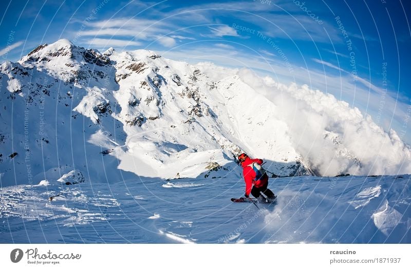 Man's skiing downhill in fresh snow. West Alps, Italy Winter Snow Mountain Sports Skiing Boy (child) Adults Landscape Sky Jacket Blue Red Extreme freeride