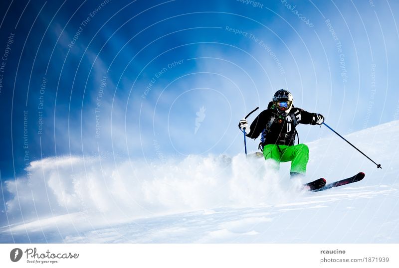 Young male freeride skier making a turn in powder snow Human being Young man Youth (Young adults) 1 Energy Climate caucasian freerider winter Ski-run Day