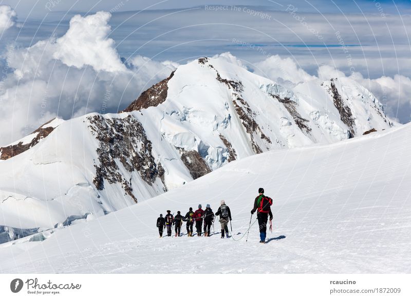 Mountaneers walking on the Monte Rosa glacier, Switzerland Adventure Expedition Winter Snow Mountain Hiking Sports Climbing Mountaineering Rope Woman Adults Man