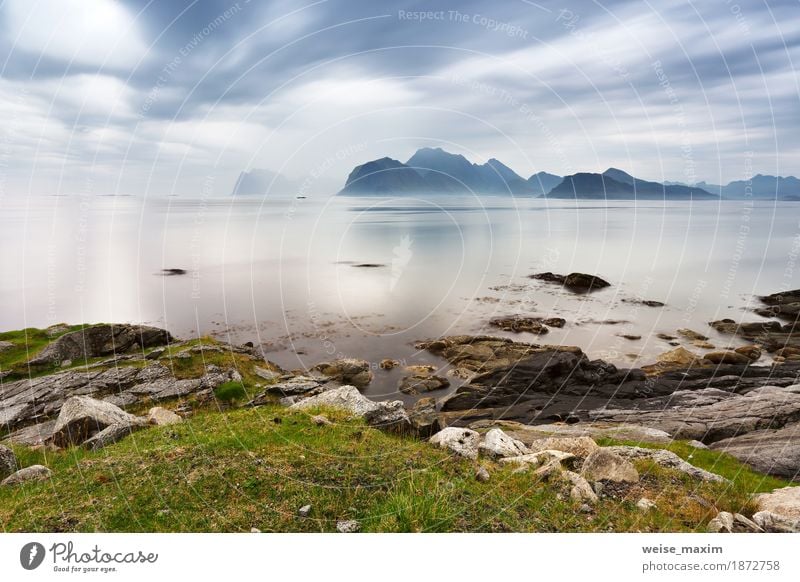 Summer cloudy Lofoten islands. Norway misty sea Vacation & Travel Tourism Far-off places Ocean Island Mountain Nature Landscape Sky Clouds Weather Storm Fog