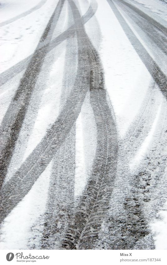 Tracks in the snow Winter Weather Bad weather Ice Frost Snow Transport Traffic infrastructure Street Driving Cold White Tire Skid marks Snowflake Line