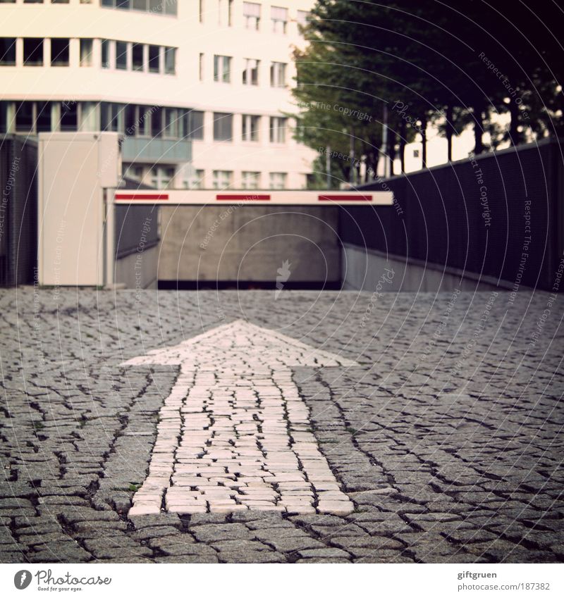 going underground Town House (Residential Structure) Parking garage Building Architecture Transport Motoring Street Lanes & trails Control barrier Sign