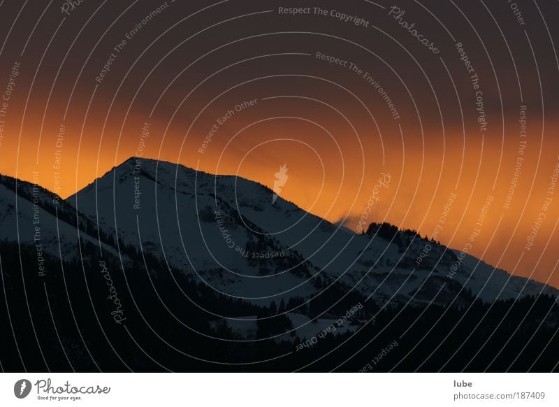 Foehn atmosphere on the mountain Tourism Far-off places Winter Winter vacation Mountain Environment Nature Air Sky Clouds Storm clouds Horizon Sunlight Climate