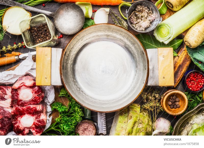 Ingredients for soup or broth around cooking pot Food Meat Vegetable Soup Stew Herbs and spices Nutrition Organic produce Crockery Pot Knives Spoon Style Design