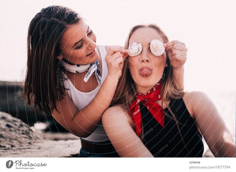 Teenager Girls pulling faces and playing with shell at the beach Lifestyle Joy Vacation & Travel Tourism Summer vacation Beach Young woman Youth (Young adults)