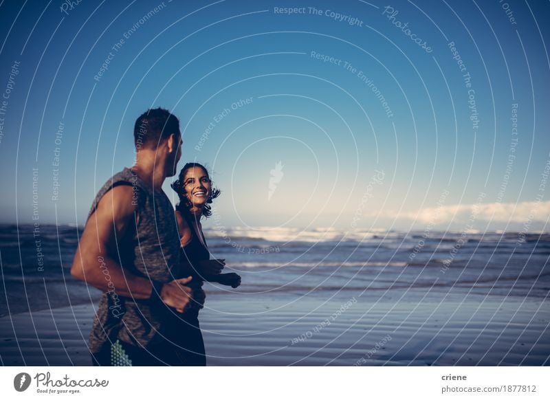 Fit couple doing running workout together on the beach Lifestyle Body Wellness Relaxation Beach Ocean Jogging Young woman Youth (Young adults) Young man Couple