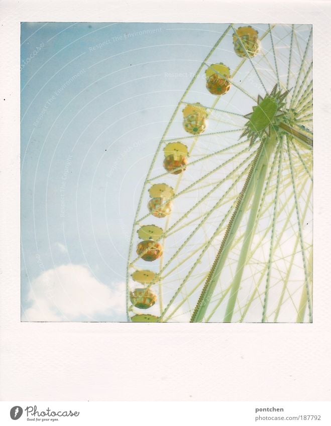 Polaroid shows a big wheel in front of a blue sky. carnival, funfair, dult Lifestyle Joy Leisure and hobbies Trip Oktoberfest Fairs & Carnivals Event Movement