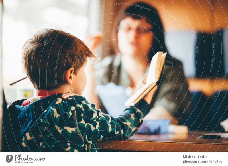 Mother and son in the railway Vacation & Travel Train travel Railroad Human being Child Adults Family & Relations Infancy 2 3 - 8 years Reading Colour photo