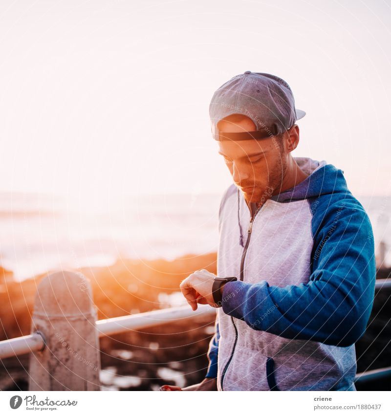 young adult man checking notification on his smart watch Computer Screen Hardware Clock Technology High-tech Telecommunications Information Technology Internet