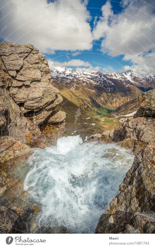 Waterfall in the mountains Environment Nature Landscape Elements Sky Clouds Beautiful weather Mountain Peak Snowcapped peak River Moody Colour photo