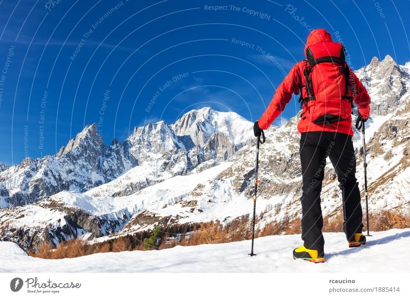 Hiker takes a rest looking at Mont Blanc, Courmayer, Italy. Beautiful Vacation & Travel Tourism Trip Adventure Expedition Winter Snow Mountain Hiking Sports