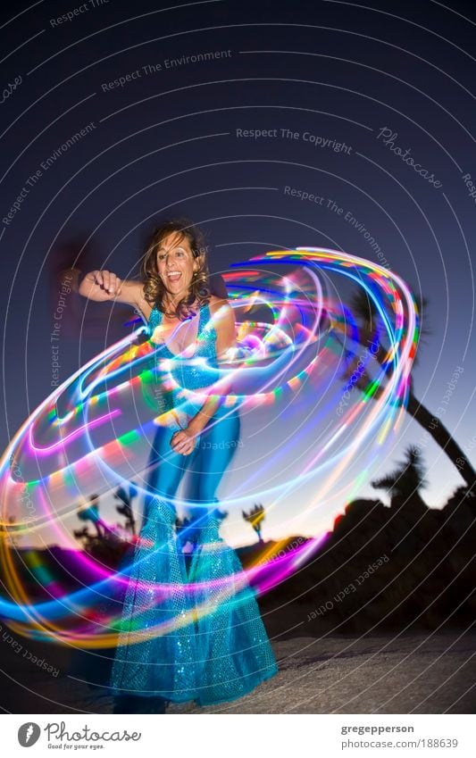 Hoop dancer performing. Exotic Life Entertainment Dance Feminine Woman Adults 1 Human being 30 - 45 years Dancer Rotate "color image" "hoop dancing" "hula hoop"