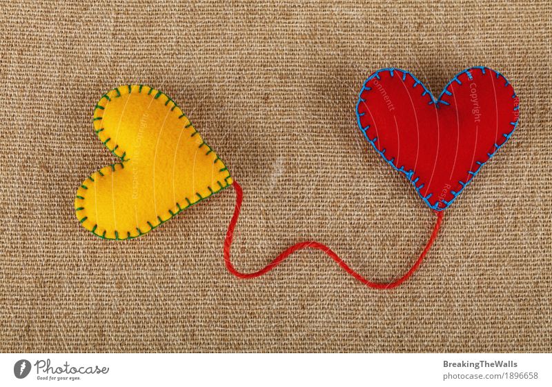 Two felt hearts yellow and red with twine on canvas Leisure and hobbies Handicraft Handcrafts Valentine's Day Wedding Art Cloth Heart Love Together Natural