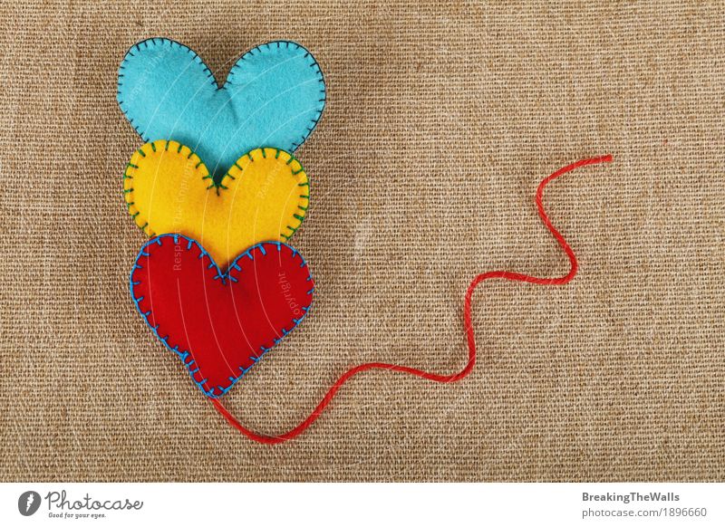 Three stitched felt hearts, yellow, red and blue, with twine Leisure and hobbies Handicraft Handcrafts Valentine's Day Easter Thanksgiving Family & Relations