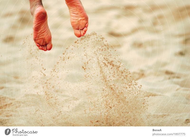 Playing beach volleyball Joy Summer Beach Sports Volleyball (sport) Sand Jump Power Action Air Powder snow Athlete Sportsperson Blur raise dust Feet Flying