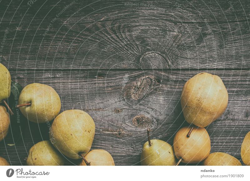 green pears on gray worn wooden background Fruit Pear Vegetarian diet Old Fresh Natural Juicy Yellow Gray Green Edible food many Meal Product ripe Shabby