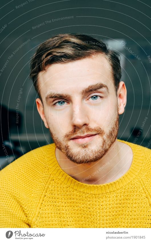 Portrait of a young man with yellow sweater in the office or at home Young man Self-confident Lifestyle Personal hygiene Face Well-being Contentment Calm