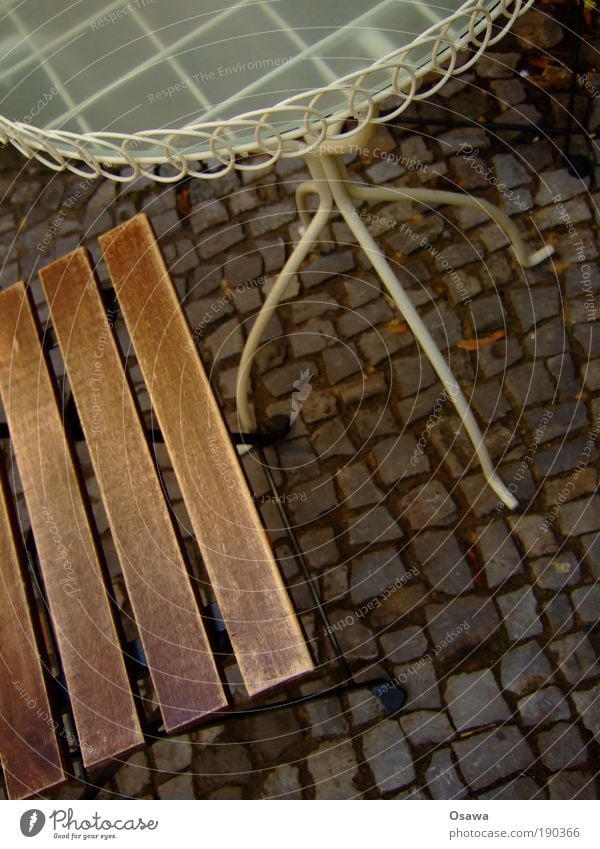 Black Furniture Chair Table Bar Deserted Sidewalk Cobblestones Break Café Sidewalk café Gastronomy Colour photo Subdued colour Exterior shot Detail