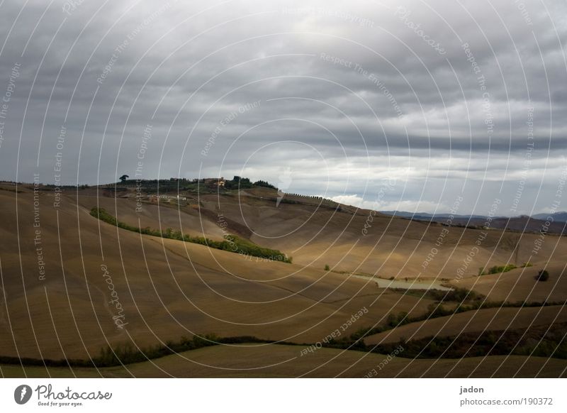 hill Senses Relaxation Calm Mountain Landscape Clouds Field Hill Lanes & trails Warmth Brown Yellow Safety (feeling of) Tourism Tuscany Exterior shot Deserted