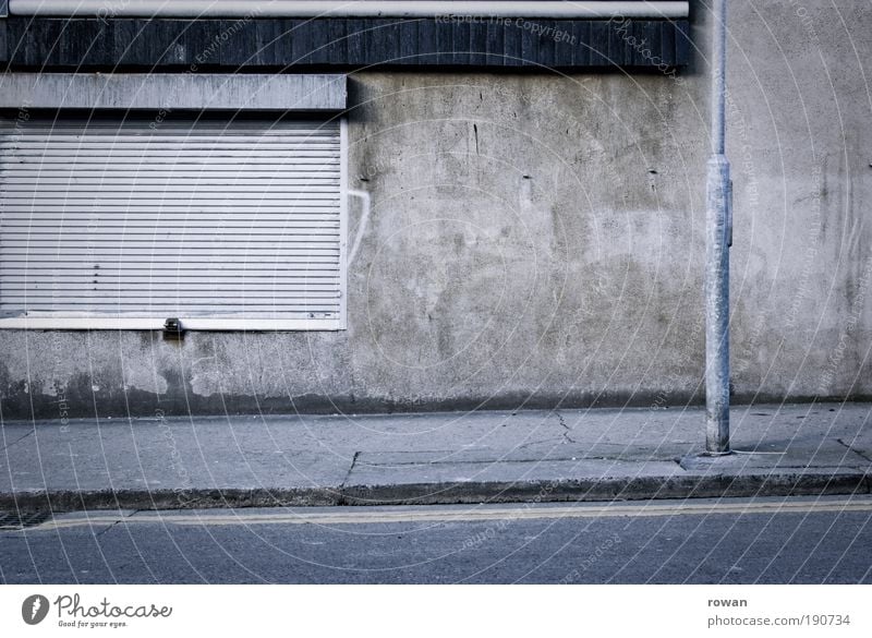 street scene in grey Wall (barrier) Wall (building) Gray Gloomy Empty Going Dark Street Asphalt Lantern Roller shutter Concrete Sadness Closed Sidewalk Black