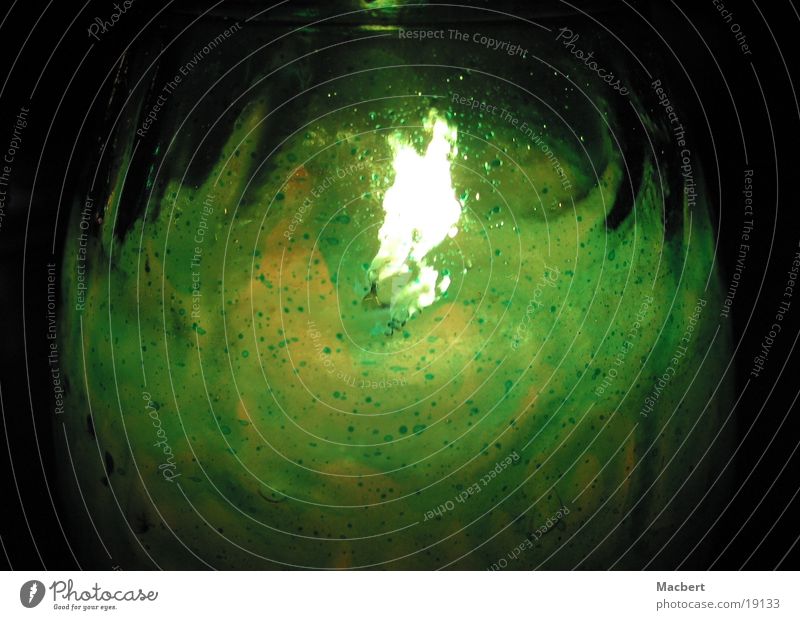 Candle in glass Green Hot Physics Living or residing Glass Blaze Warmth Bright Flame