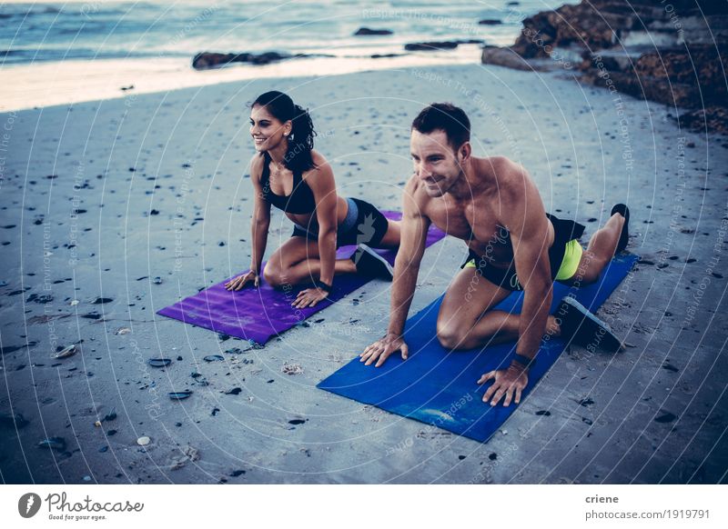 Caucasian fit young adult couple doing stretching exercises Lifestyle Joy Happy Athletic Fitness Beach Ocean Human being Young woman Youth (Young adults)